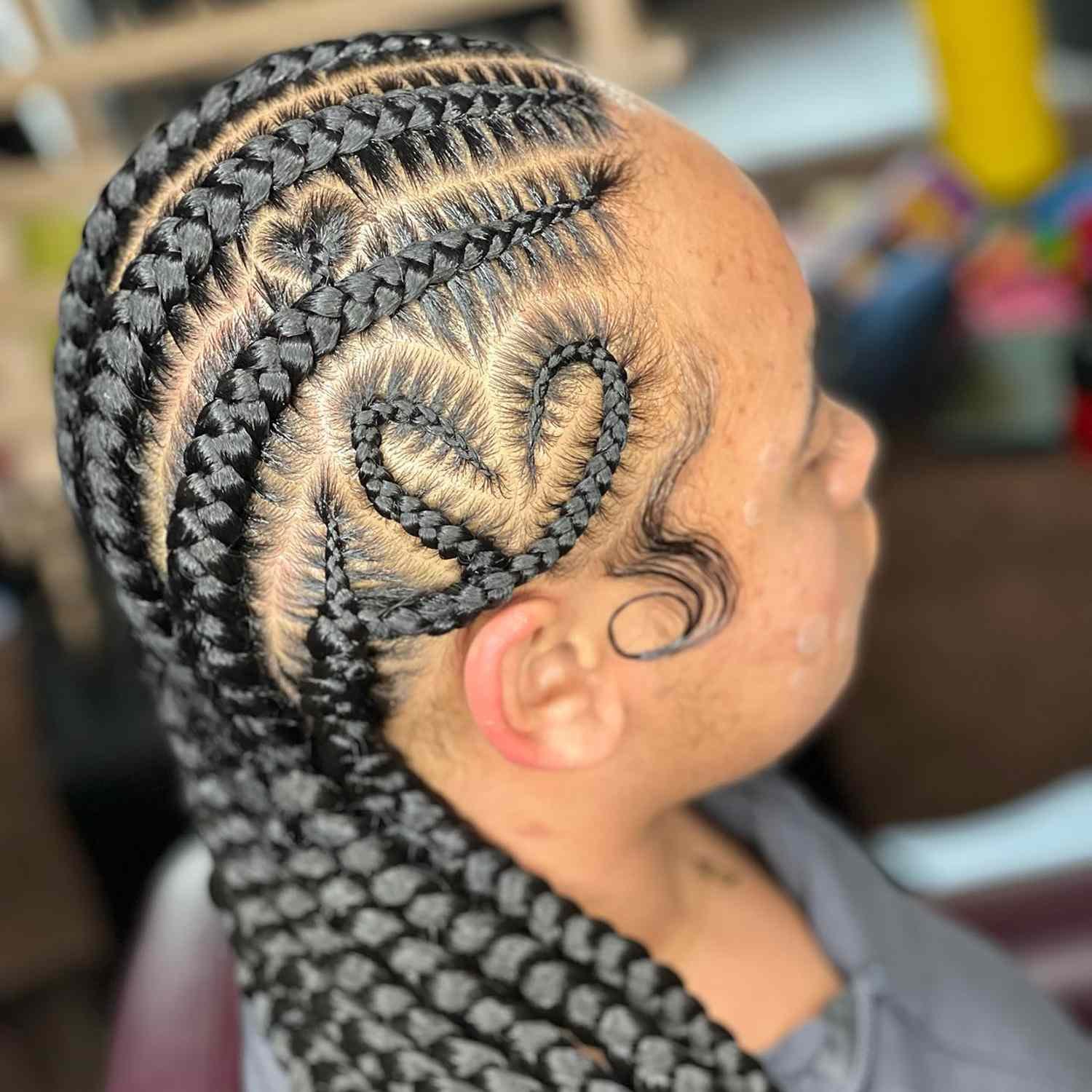 Close up of cornrowed hair, a braid designed on the side