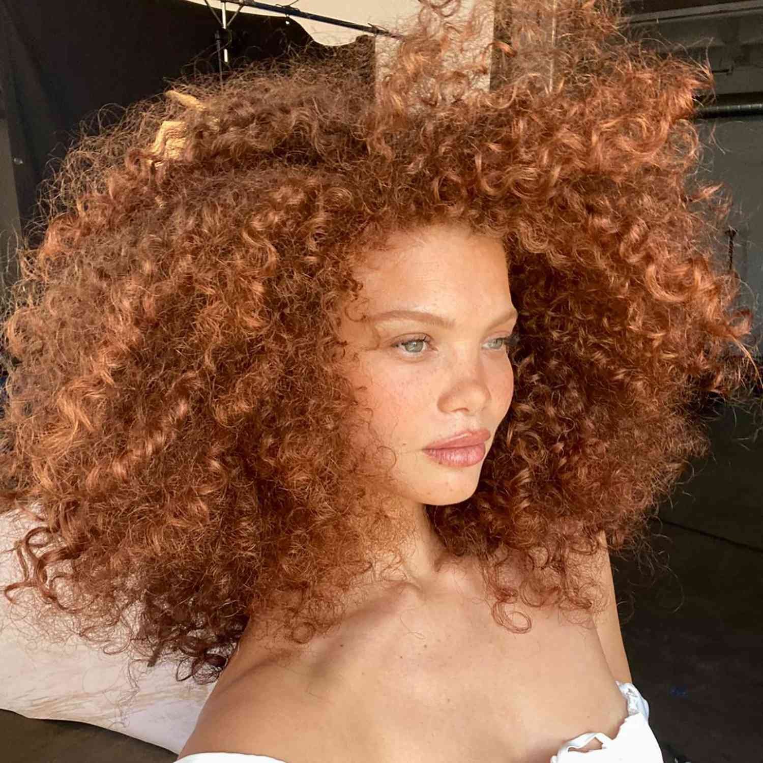 Model Carmen Solomons with her natural warm copper hair color 